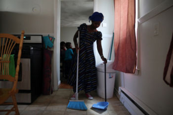 Vanisi cleans the kitchen at her home in Lowell. “You have to keep your house nice and clean,” case manager Sabyne Denaud said. “You never know who’s going to come to the apartment.”
Their vetting process took nearly three years, the family said. A total of 684 Congolese refugees arrived in Massachusetts from 2011 to 2015, according to the state Department of Public Health.
