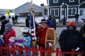 Fort Kent, ME -- 3/4/2017 - Brian J. Theriault, Master Snowshoe Maker from Fort Kent, braved the sub-zero wind chill to watch the start of the 2017 Can-Am Crown Race.