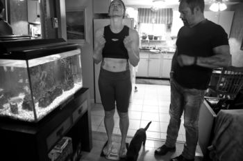 Aleksandra celebrates after checking her weight Ñ 147 pounds Ñ at home in Marshfield. She had been training for seven weeks and said she was on a Òhigh protein, very low fat diet because I lose a lot of body fat . . . . I work out more but IÕm eating less so you create a calorie deficit. ItÕs a pain, youÕre hungry all the time.Ó