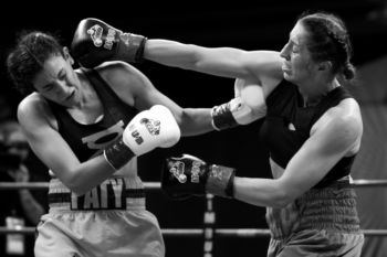 Aleksandra (right) trades punches with Ramirez early in the match. Aleksandra said she fights because Òit challenges me on a whole different level, it challenges your confidence inside and what you can deliver under pressure in the ring. EverybodyÕs watching and your opponentÕs there to beat you to the punch. ItÕs the one thing that even now after all this time, after all this training, IÕm still not the best. And it drives me crazy and it also keeps me hooked on it.Ó