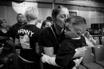 Aleksandra kisses MJ Lopes, 5, after a ceremony inducting his father, Manny Lopes, into the CES Ring of Honor on April 7. She said Manny was the first person she ever sparred with in a boxing ring, which resulted in her meeting her future husband, Wayne.