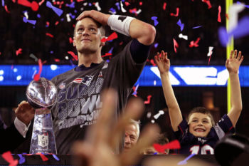 Hundreds of thousands flocked to the city streets of Boston to celebrate the New England Patriots' record-breaking Super Bowl win, the fifth win since 2002.
New England Patriots quarterback Tom Brady and his son Benjamin celebrate with the Lombardi trophy after beating the Atlanta Falcons in Super Bowl LI at NRG Stadium in Houston on Feb. 5, 2017.