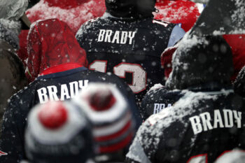 New England Patriots fans stood for hours in the snow, sleet, and freezing rain to see their team at city hall plaza during the New England Patriots Super Bowl Parade 2017.