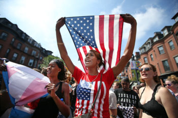 Persia Brewer of Dorchester marches with thousands of others down Tremont St from Roxbury to the Boston Common in a counter protest the Free Speech rally