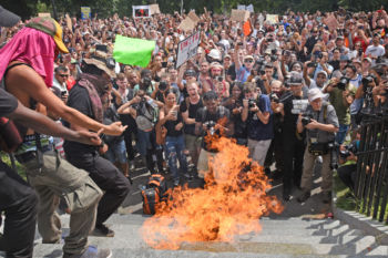 A confederate flag is burned on The Boston Common
