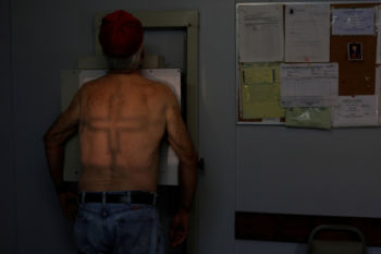 The Black Lung Disability Trust Fund is at risk of insolvency - as black lung rates hit highs not seen in decades - which could force the fund to restrict benefits or shift some of the financial burden to taxpayers. Government research shows the incidence of black lung rebounding, despite improved safety measures. In February, the National Institute for Occupational Safety and Health confirmed 416 cases of advanced black lung disease in three medical clinics in rural Virginia from 2013 to 2017 - the highest concentration of cases ever seen.
Retired coal miner James Marcum, who has complicated black lung disease, stands for a chest x-ray at the Stone Mountain Health Services in St. Charles, Virginia, U.S., May 18, 2018. Marcum worked at a surface strip mine for 20-25 years, but has not yet been approved for benefits for his black lung disease.