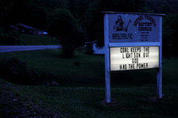 The sign outside the Bethel Freewill Baptist Church reads "Coal Keeps the Lights On But God Has the Power" in Virgie, Kentucky, U.S., May 18, 2018.