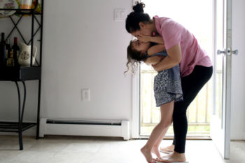 Patricia Carbajal fled Honduras 19 years ago and has been living in the United States legally as a Temporary Protected Status (or TPS) holder ever since. For 19 years she has worked, paid taxes, and passed a criminal background check every 18 months. Now, the Trump administration has cancelled the program that has allowed her to create a life as a mother, a construction worker, a budding activist.
Patricia doesn't want her daughter, Camila, to know how nervous she is about the impending TPS decision from the Trump Administration so she tries to hide her anxiety from Camila, scooping her up and kissing her as Camila plays in their kitchen.