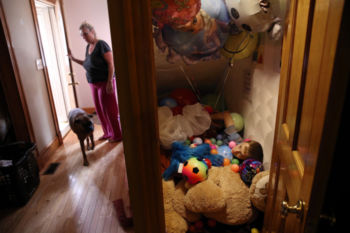 Connor rested in his "sensory closet,'' while his mother let in the dog at their home. Roberta explained that Connor suffers from sensory processing disorder, meaning "he doesn't know where his body is in space." The closet under the stairs is filled with comforting objects: pillows, blankets, stuffed animals, toys, and balloons. He buries himself among his favorite things. Roberta said their weight signals his nervous system to calm down. "He can stay in there for hours,'' she said.
Roberta suspected soon after Connor was born that something was wrong, but her family thought she was being dramatic. He had rituals, such as counting ceiling fan blades, and an obsession with balloons. He was diagnosed with autism at age two.