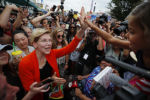 Democratic 2020 U.S. presidential candidate and U.S. Senator Elizabeth Warren high fives a girl at the Iowa State Fair in Des Moines, Iowa, August 10, 2019.