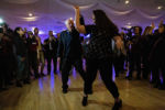 Democratic presidential candidate Sen. Bernie Sanders (I-Vt.) dances with an attendee during a labor union appreciation dinner at the Executive Court Banquet Facility in Manchester, N.H., on Saturday, Nov. 23, 2019.