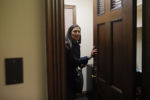 Deb Haaland changes clothes in her office after being sworn in as one of the first two first Native American women in the U.S. House of Representatives in Washington, January 3, 2019.