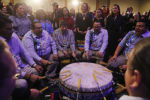 U.S. Representatives Deb Haaland (top R) and Sharice Davids (top, 2nd R) are honored by Ho-Chuck tribal drummers at a reception hosted by the Congressional Native American Caucus in Washington, January 3, 2019.