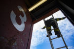 Recruits practice comfortable leg locking at four stories in the air during ladder drills at station six in Brockton on Tuesday, May 7, 2019.