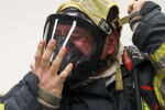 Daniel Lange races to set up his SCBA, finishing first during the timed drill at Brockton fire station No. 1 on Wednesday, April 10, 2019.