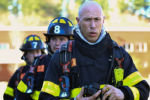 Greg Hilliard, 27, removes his helmet and SCBA after experiencing a room full smoke from real fire during the Brockton Fire Academy recruits' first training day at the Massachusetts Department of Fire Services in Stow on Thursday, April 25, 2019.