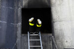 Brockton fire recruit Myles Chartier, 26, disappears into the burn building head first during search and rescue training at the Massachusetts Firefighter Academy in Stow on Thursday, April 25, 2019.
