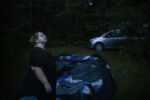 BIDDEFORD, ME - 07/13/2019 Mariah LeMieux-Lupien sets up her family's tent in the waning moonlight next to beachgoers and vacationing families at Shamrock Campground in Biddeford, Maine. The Lupien family would be making the tent their home.. "My outer shell is very good at appearing like I'm fine. I'm not. It's fight or flight that has taken over. I'm not able to go into stores again, the lights and people crawling all over, it's too much and I feel like a failure," said Mariah. "I do what I'm doing because it's what I need to do while the hubby works. I do it because it's better than doing nothing and feeling helpless. Hopeless, yes, I feel that way. But helpless no."