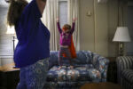 EXETER, NH - 11/23/2019 Laya Lupien lifts up her arms in her best superwoman pose while she plays with her mother Mariah during one of their last nights at Seacoast Family Promise, a shelter program in Exeter, NH that rotates the family through churches every week for a place to sleep and eat. After receiving threats from the Maine Department of Health and Human Services that their children could be placed into the care of the state, the Lupien family chose to leave behind everything and move to New Hampshire for the program. ÒThe advice given - get into a shelter or get into an apartment . . . or the kids will be taken away,Ó Mariah wrote about the visit in late July. She tried not to despair. ÒDylan hugs me, whispers in my ear Ôah wuv ooo,Õ?ÕÕ she wrote. ÒAll I feel is that I have failed him and Evan and Laya.Ó