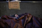JULY 24, 2019: Bewildered at the start of a new day, Jonathan Raulino emerges from beneath a tarp and rubs his eyes outside South Station in Boston, Mass., United States. Gaunt and weather-beaten, the 32-year-old Raulino hankers for a cigarette, coffee, and a meal.
For the homeless, South Station offers at least some protection. The droves of people bring a swarm of police, and that means it's less likely someone like Raulino will be robbed or beaten.