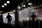 JULY 24, 2019: A conductor prepares to board a departing commuter train at South Station in Boston, Mass., United States. Before the bedlam is the quiet. South Station stirs to life, hushed and calm. Soft footsteps and low voices echo across the sparsely crowded terminal. The day is about to begin.