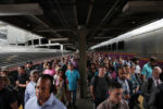 JULY 24, 2019: Commuters fill the platform as they arrive during the morning rush at South Station in Boston, Mass., United States.
During the Golden Age of rail travel, South Station was the busiest train terminal in the Western world, "outdistancing Grand Central and Penn stations in New York, Waterloo in London, or the Gare St. Lazare in Paris, the other giants of the time," geographer James E. Vance wrote.