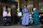 JULY 24, 2019: Members of the Brenneman family prepare to board an Amtrak train at South Station in Boston, Mass., United States. The Amish family was heading home to Iowa after vacationing in Maine.