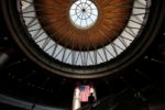 JULY 24, 2019: A man ascends an escalator at the South Station bus terminal in Boston, Mass., United States. The station is a gateway through which someÊ128,000 passengers travel, either coming or going, every weekday on trains, subway cars, and buses.