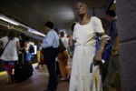 JULY 24, 2019: Dorothy Durgess waits for a Red Line train at South Station in Boston, Mass., United States. Durgess was returning home after shopping in the city.
The story of South Station is the story of all passenger-railway stations in the United States: decline and disrepair post-World War II, as travelers turned to automobiles and sprawling suburbs.