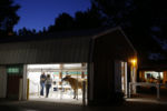 Waupaca, WI, 08/23/2019 -- People chatted inside the Milking Barn at the Waupaca County Fair. It has been a dastardly year for Wisconsin farmers: 718 dairy farms have closed since January, and those who grow commodity crops like corn or soybeans are suffering, too. The reasons are complex, but farmers and economists say long-running problems have been exacerbated by TrumpÕs trade wars, which have winnowed global markets for the agricultural products that come from heartland towns.