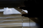 Milwaukee, WI, 08/21/2019 -- Stacey Hodges Harmon pushed open the blinds inside her bedroom window where the bullet came through as she and her five year-old son William were sitting together on the bed. She has not slept in her bedroom since. Milwaukee is the most racially segregated metropolitan area in the country, according to a 2018 study by the Brookings Institution, cut up by rivers and highways. While cranes and shiny new buildings rise in the downtown Third Ward, gun violence and poverty stubbornly plague other areas.