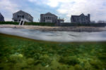 The homes on Spring Hill Beach on Salt Marsh Road in Sandwich sit right on the beach as erosion from storms has washed away much of the beach sand leaving nothing but rocks along the coastline. Many of the homes have been rebuilt over the years the shifting currents keep washig away the sand needed to protect the shoreline.
