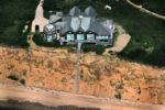 A mansion is perched precaiously on an eroding dune near Great Island trail off Chequesset Neck Road in Wellfleet. The trustee-owners of the home would like to build a 240-foot stone revetment to shore up the dune-construction that is generally disallowed in the seashore because of its environmental implications. It's a matter of time before erosion claims the property.