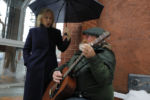 Democratic 2020 presidential candidate and U.S. Senator Kirsten Gillibrand sings along with street musician Kevin Clark in Concord, New Hampshire, February 15, 2019.