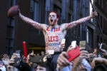 A very enthusiastic fan celebrates during the New England Patriots Super Bowl LIII victory parade in Boston on Feb. 5, 2019.