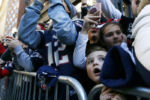 Fans react as Tom Brady's duck boat approaches during the Patriots Super Bowl Victory Parade.