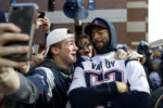 New England Patriots Kyle Van Noy poses for a picture with a fan during the New England Patriots Super Bowl LIII victory parade in Boston on Feb. 5, 2019.