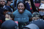 A demonstrator yells at Boston police officers during a rally following the death in Minneapolis police custody of George Floyd, in Boston, Massachusetts, June 2, 2020.