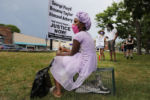 Eight year-old Chastity Everett brought her kitten Angel to a demonstration against racial inequality in the aftermath of the death in Minneapolis police custody of George Floyd in Boston, Massachusetts, June 21, 2020.
