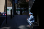 Boston, MA - 3/27/2020: A healthcare worker rests on a step outside Brigham and Women's Hospital in Boston, MA.
Hospitals are offering mental health services to workers, from one-on-one counseling to group sessions.