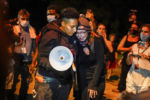 Hannah Gittings, right, is consoled while talking about her boyfriend, shooting victim Anthony Huber, while marchers pause near the scene where he was killed protesting last night the police shooting of Jacob Blake in Kenosha, Wis., Wednesday, Aug. 26, 2020. Gittings described Huber as the Òlove of her life.Ó A white, 17-year-old, was arrested Wednesday on suspicion of first-degree homicide in Tuesday's shootings.