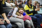 PLYMOUTH, NH - 02/10/2020 Charlotte Smith, left, hugs her younger sister Evelyn as they listen to the former mayor of South Bend, Indiana, Pete Buttigieg speak at his Get Out the Vote event at Plymouth State University in Plymouth, NH.