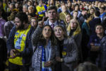 NASHUA, NH - 02/11/2020 Annabelle Bartlett, left, and Ashley Tuzik watch coverage as the polls begin to close at an election party for the Former South Bend, Indiana, Mayor Pete Buttigieg. Hundreds filled the gym at Nashua Community College to watch as the results of the Democratic Primary in New Hampshire come in on Tuesday, February 11. Across the country, all eyes are on the election results in New Hampshire as this is the first primary of the 2020 election season.