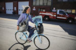 CAMBRIDGE - 2/17/2020:
Jameson Quinn (cq) and his dog Shasta bike home after attending a canvassing event for Elizabeth Warren for President in Cambridge ahead of the Massachusetts presidential primary on Super Tuesday.