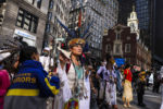 BOSTON, MA - 10/10/2020 Chali'Naru Dones, with the United Confederation of Taino People, marches past the Old State House while participating in the Indigenous Peoples Day rally and march on Saturday afternoon. The United American Indians of New England organized a demonstration on Saturday to continue the ongoing movement to change Columbus Day to Indigenous Peoples' Day and to demand the City remove the Columbus statue from Christopher Columbus Waterfront Park for good.