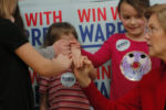 Democratic 2020 U.S. presidential candidate and U.S. Senator Elizabeth Warren (D-MA) does a "pinkie promise" with a group of girls before a Get Out the Caucus rally in Ames, Iowa, February 2, 2020.
