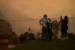 2020 was another record setting year for wildfires in Southern California. There were over 9,000 fires and over 4 million acres of forest burned.
People watch the Blue Ridge Fire burn near homes in Irvine, California.