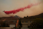 2020 was another record setting year for wildfires in Southern California. There were over 9,000 fires and over 4 million acres of forest burned.
A helicopter drops fire retardant over the Silverado Fire in Irvine, California.