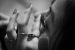 Lita, 15, plays with her fake eyelashes while waiting for others to prepare for her cousin Raeven's Sweet 16 party on February 29, 2020.