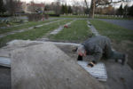Everett, MA--12/10/20-- Alan Giangregorio inspects a grave to make sure it's ready for the next day's burial at Woodlawn Cemetery. Despite the nature of the work, Giangregorio is an optimistic sort. He is quick to point out that, improbably, no one in his crew has yet contracted the virus.